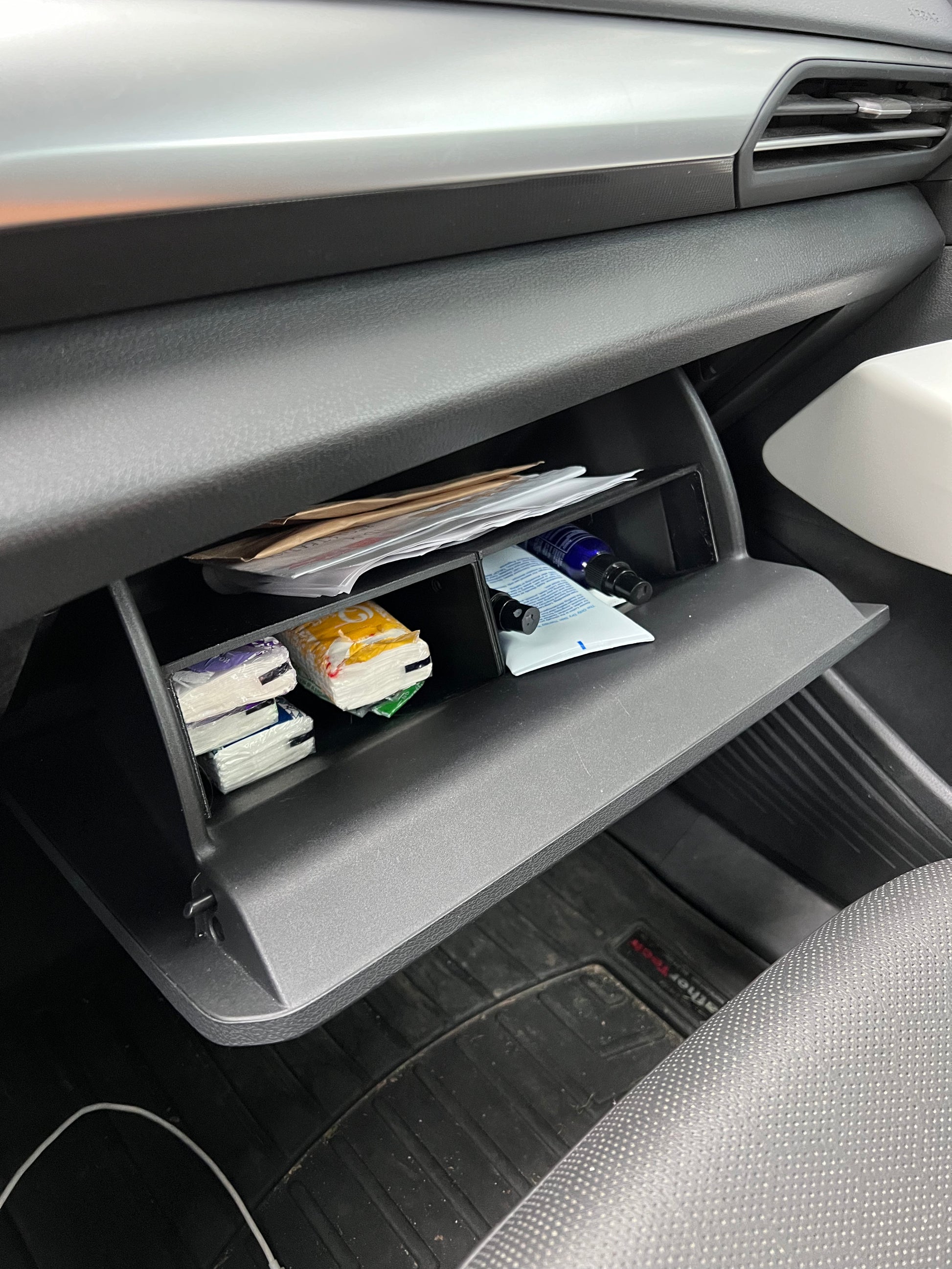Shelf for wireless charger compartment for VW ID4, ID.5 allows for