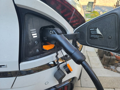 AC and DC port covers from YURIK Accessories installed on KIA EV6