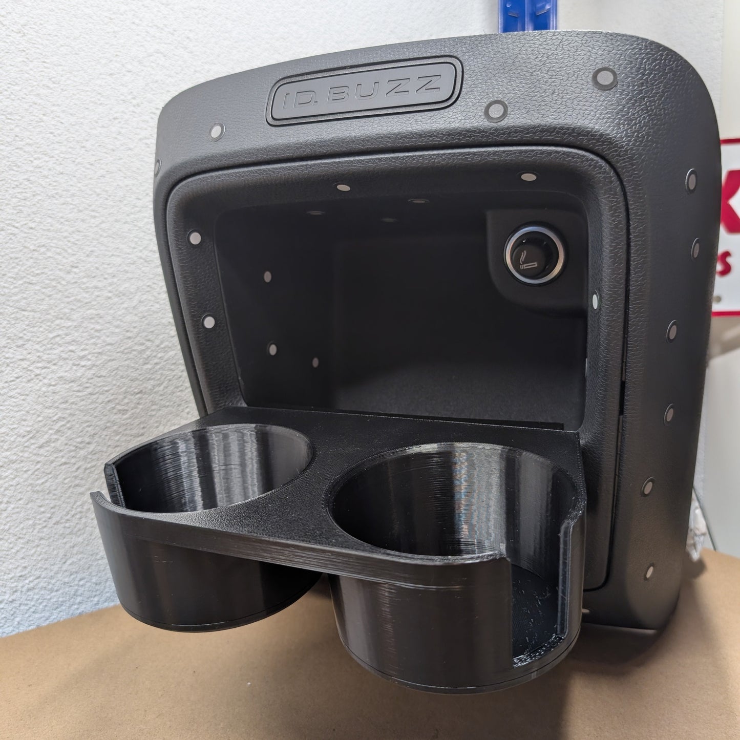 cupholder is inserted into the opening of the central console of ID.BUZZ Cargo